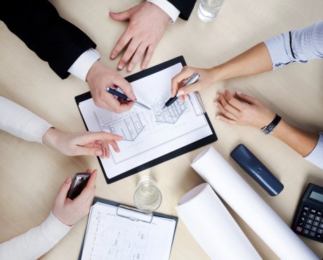 Hands of business people at the table at the meeting in the office. top view